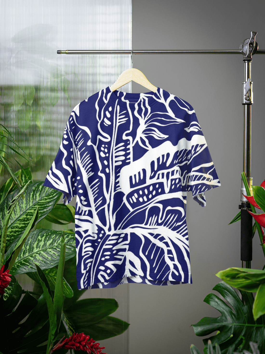 Man wearing an oversized t-shirt, Blue Life from The Edi Archive, on a blurred street background