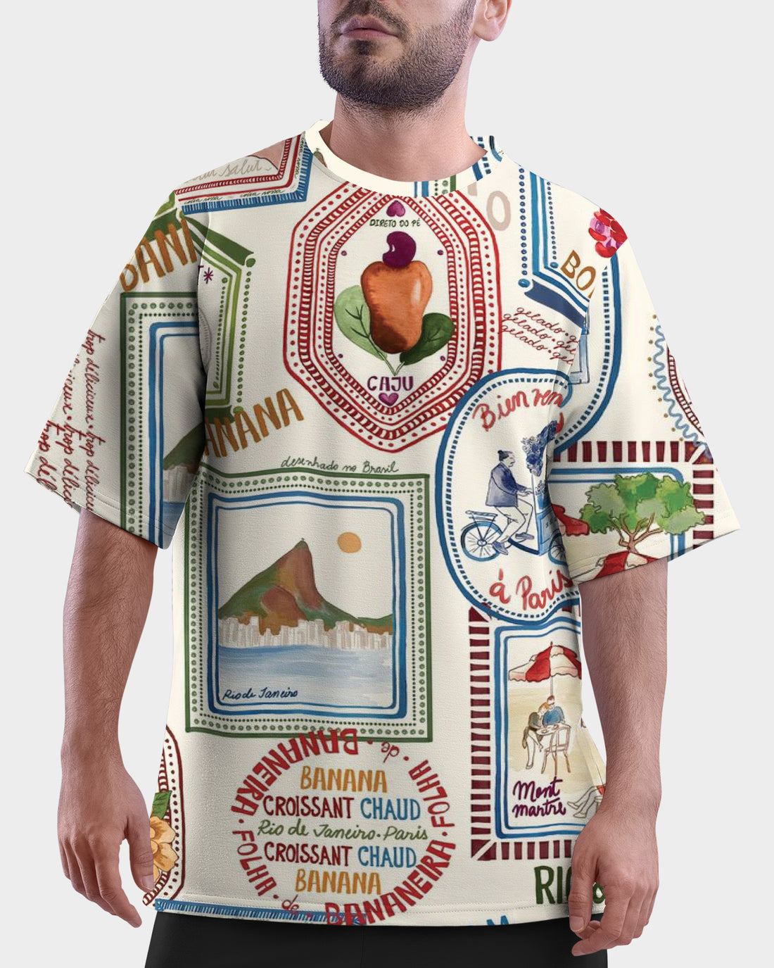 Man with a colorful Bonjour Unisex Oversized T-Shirt From The Edi Archive, and bicycle waving, palm trees in the background