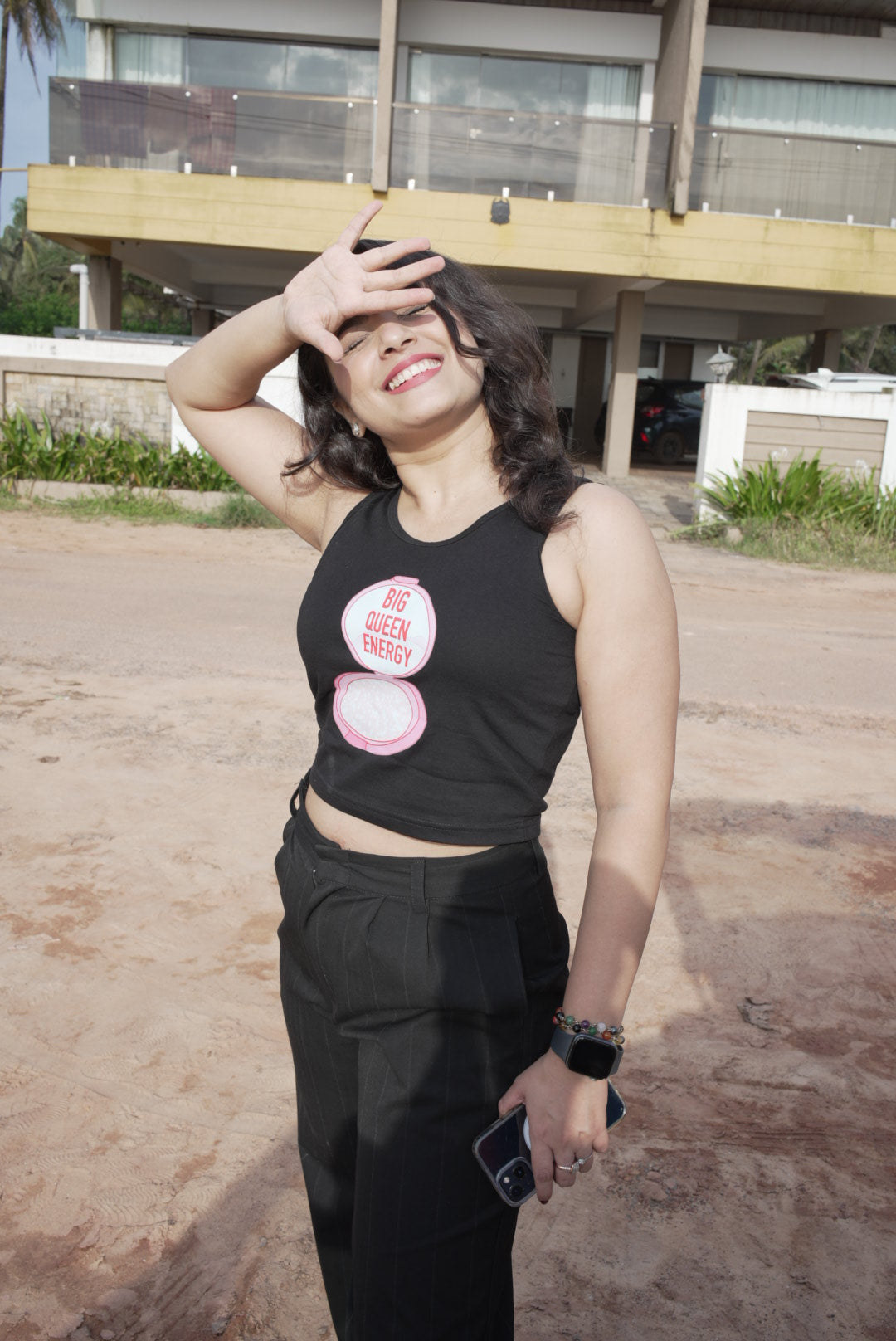 A woman wearing the black Big Queen Energy crop tank top from The Edi Archive’s Ctrl+Me Collection – bold, stylish, and unapologetically queen.