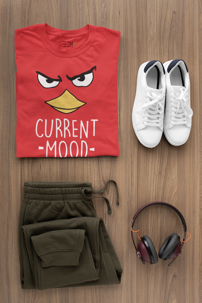 Man styled in The Edi Archive’s 'Current Mood' T-shirt with formal pants, showing a sharp full-body smart-casual look.