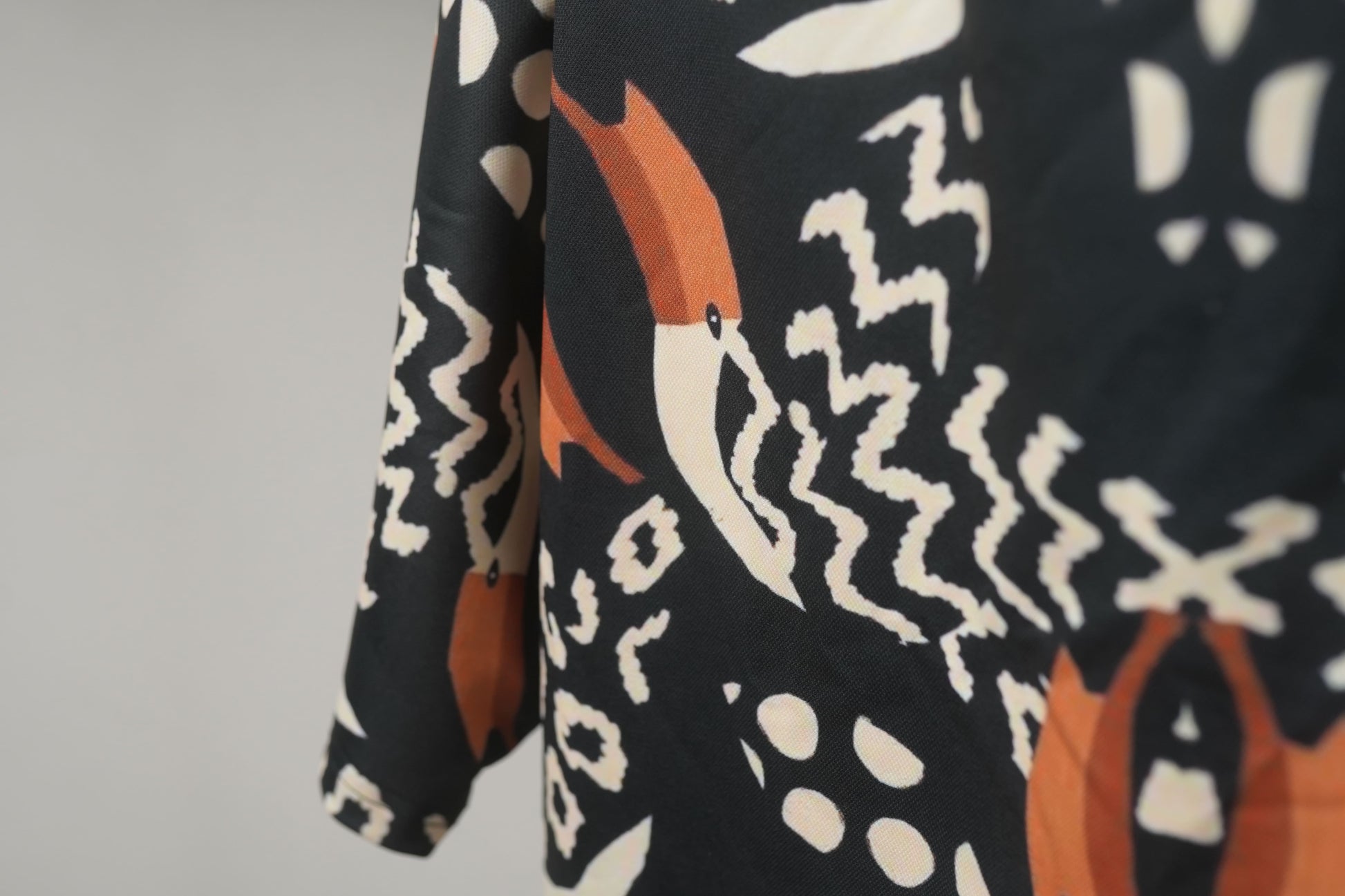 Macro image of  Pelican Breeze Unisex Oversized T-Shirt from The Edi Archive, fabric showing lightweight shiny drifit texture