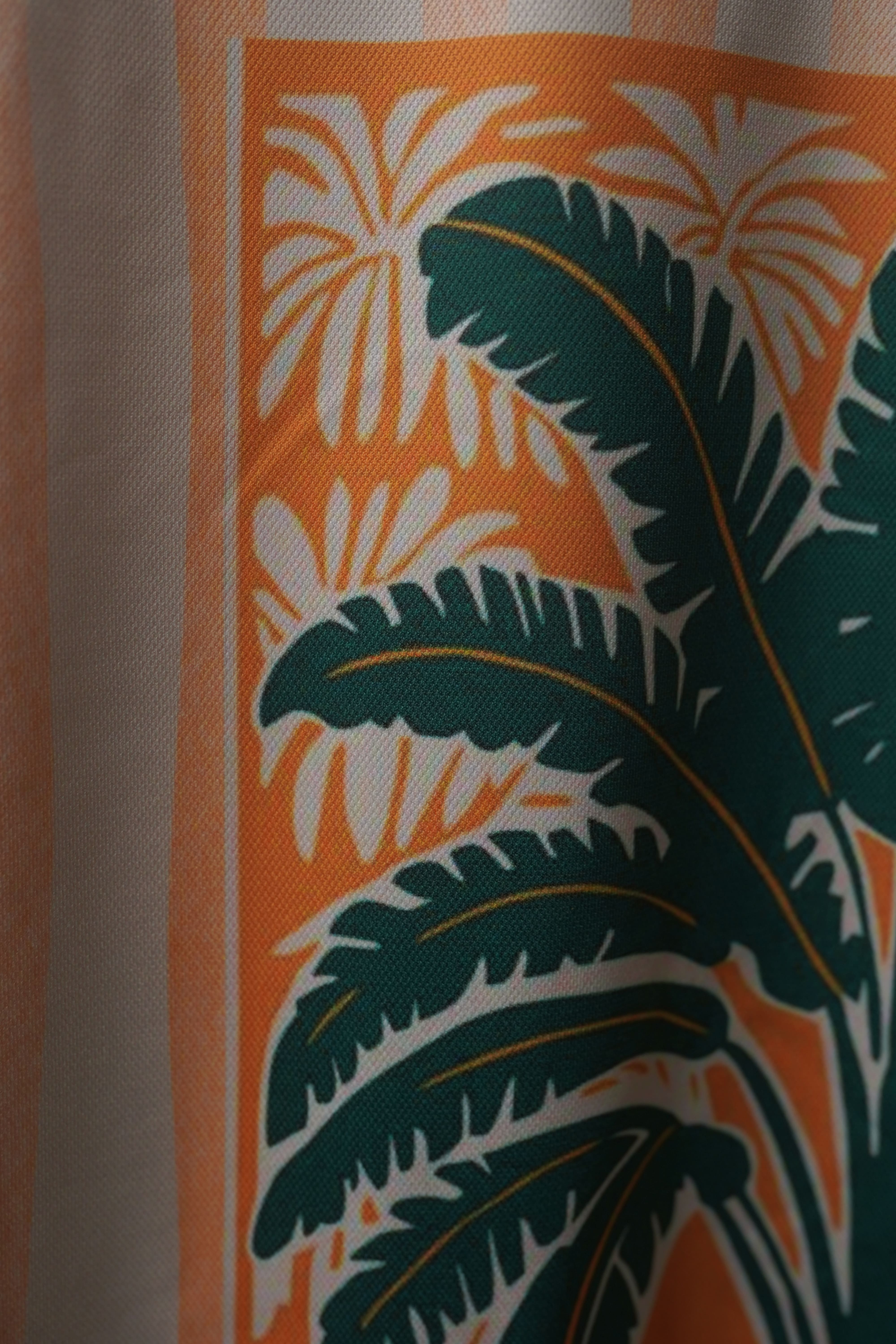 Macro shot of Azure Palms Unisex Oversized t-shirt from The Edi Archive,  fabric showing lightweight drifit texture and finish