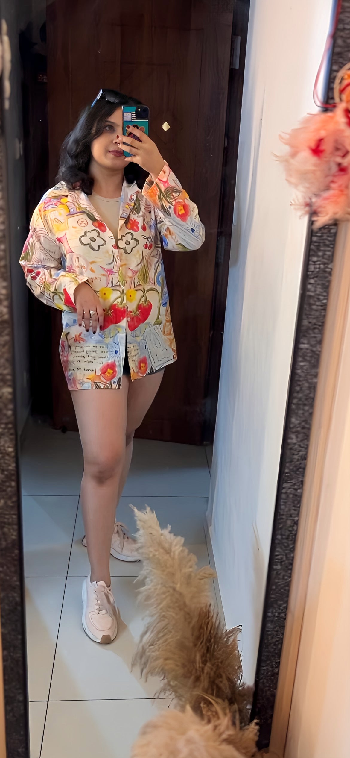 A woman wearing the 'It’s Ok' oversized shirt by The Edi Archive — relaxed poly linen fit, styled effortlessly from the Tropical Drop collection.