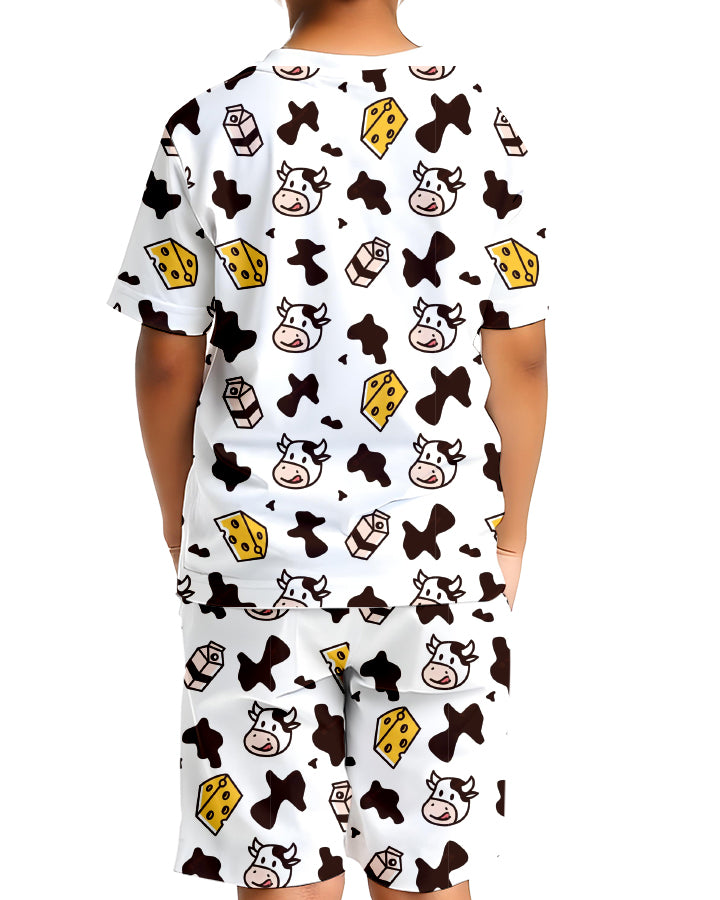 Child wearing Moo Baby Kids Co-Ords Set front view with bold cow print T-shirt and shorts