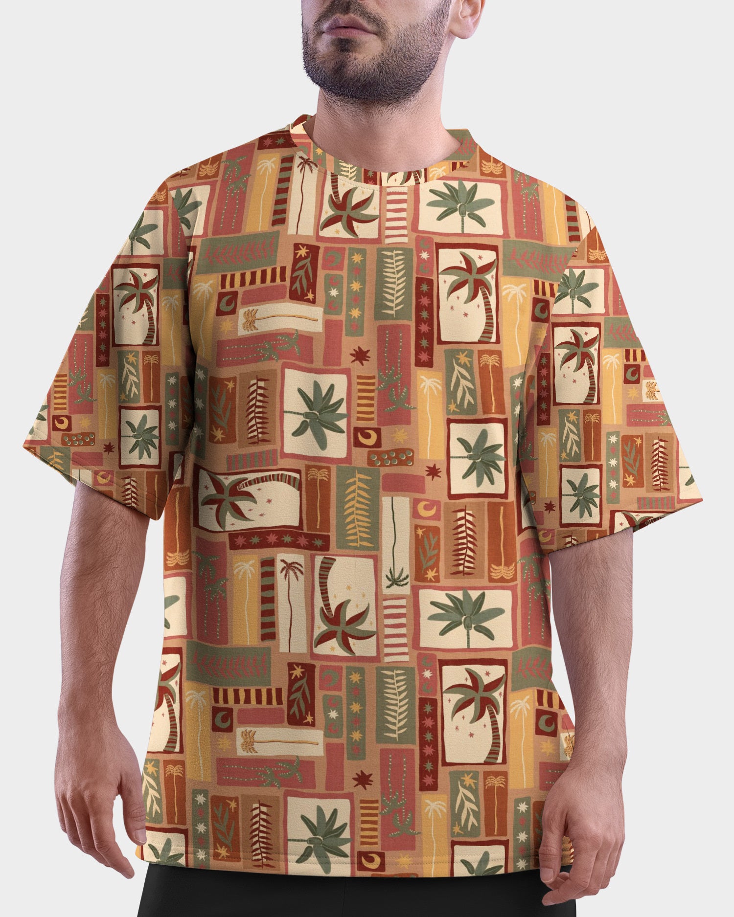 Model wearing Summer Dreams Unisex Oversized T-Shirt from The Edi Archive, front view with soft tropical all-over print