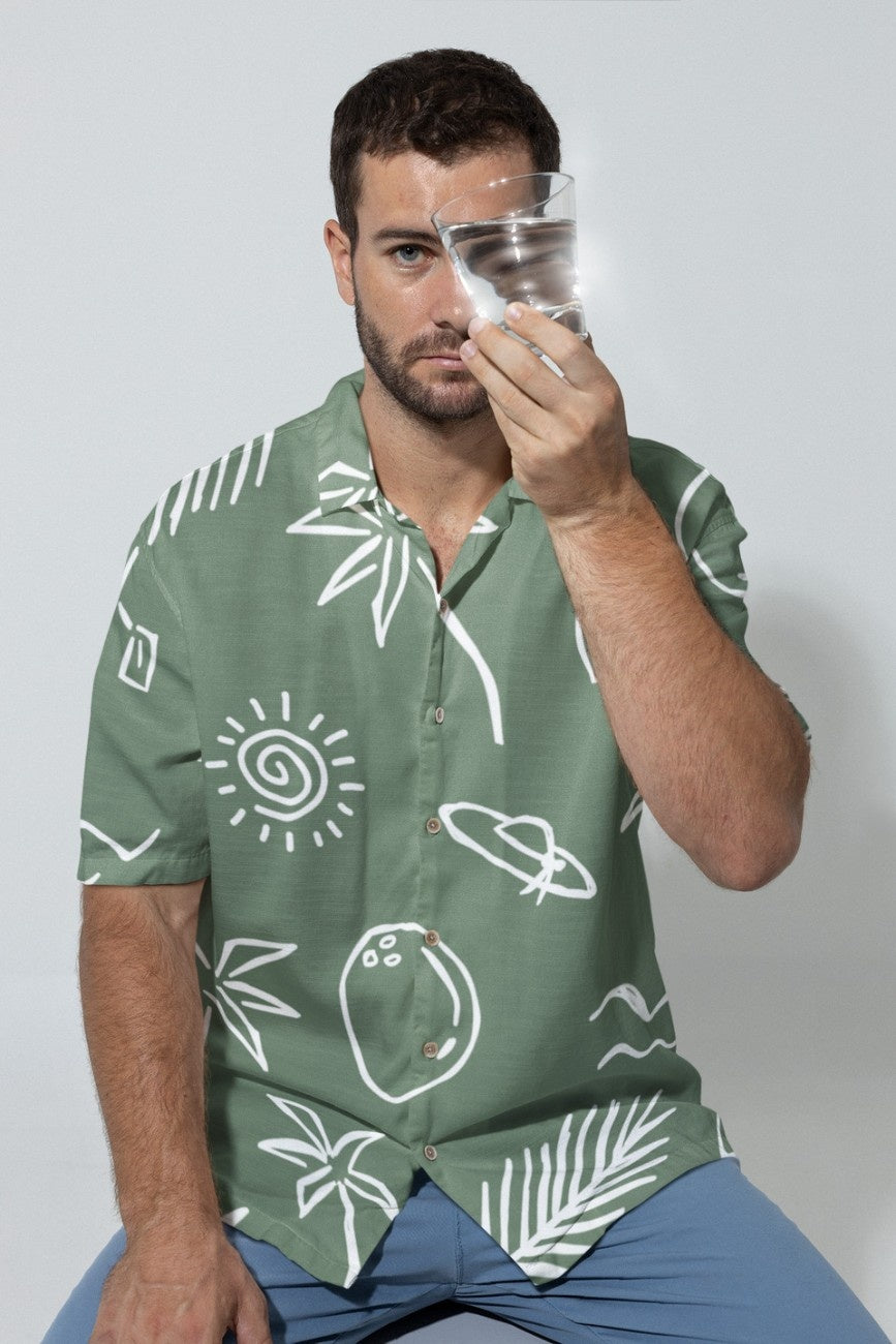 Man wearing Teal Beach Men's Linen Shirt from the Tropical Drops Collection from The Edi Archive