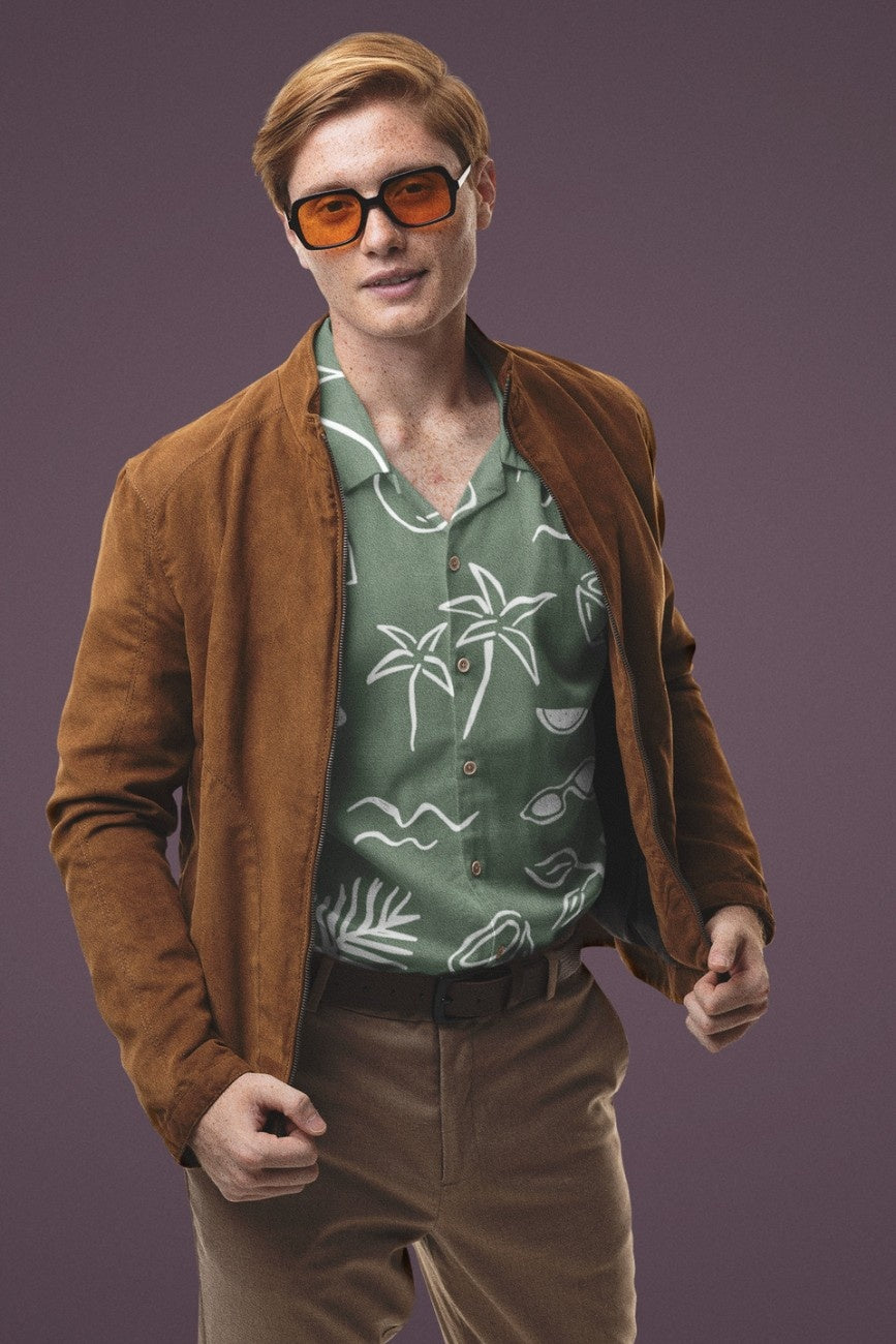 Man wearing Teal Beach Men's Linen Shirt from the Tropical Drops Collection from The Edi Archive