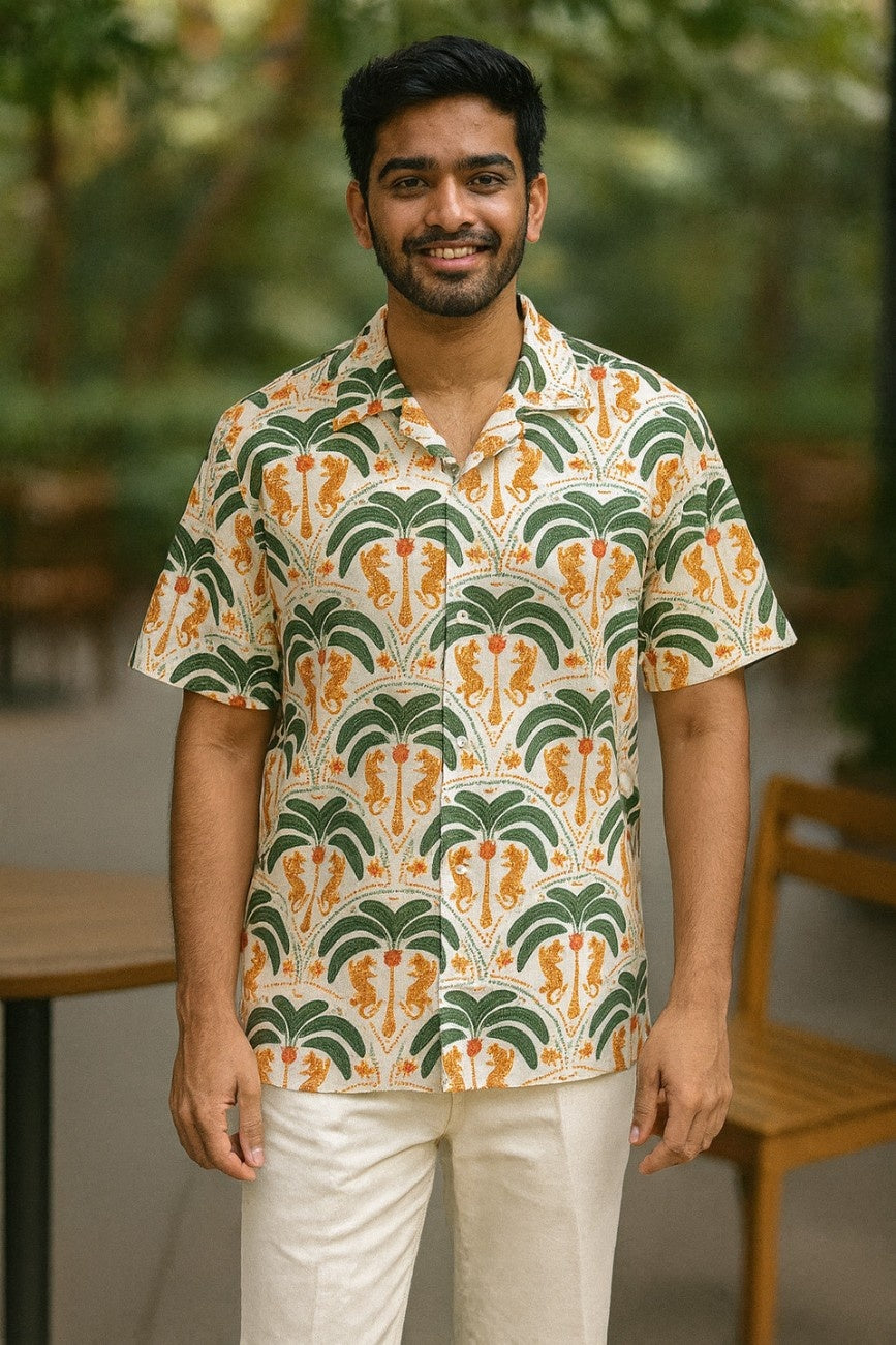 Man wearing Tiger Palms Men's Hawaiian Shirt from Tropical Drops from The Edi Archive, shirt with a cityscape in the background