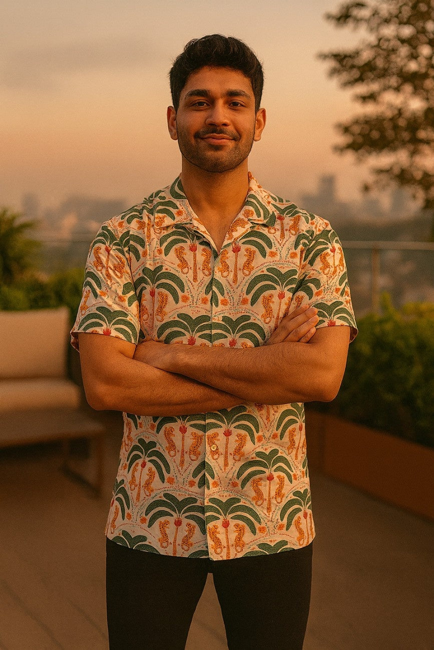 Man wearing Tiger Palms Men's Hawaiian Shirt from Tropical Drops from The Edi Archive, shirt with a cityscape in the background