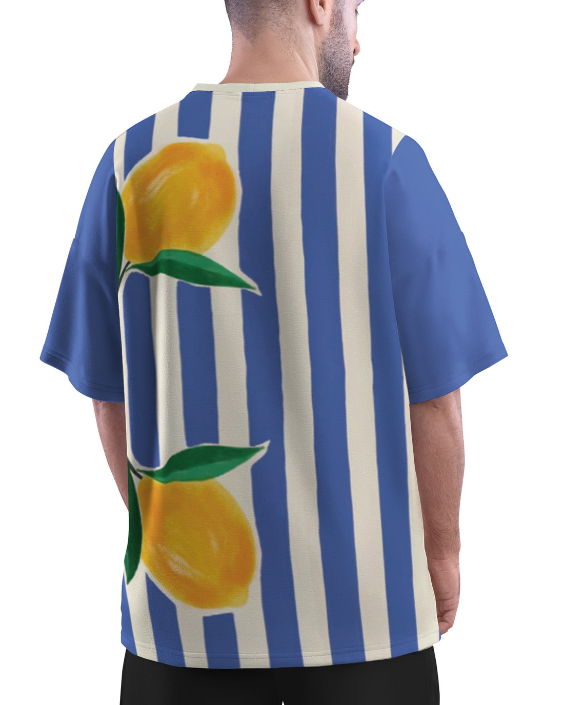 Man wearing Zesty Blue Unisex Oversized T-Shirt from The Edi Archive, on a city street.