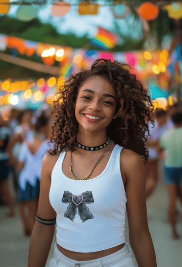 Girl wearing white cotton crop tank top with soft black watercolor lace bow design, styled in elegant yet edgy queen-core energy.