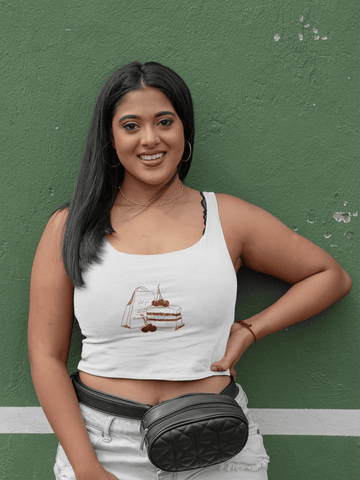Girl wearing white cotton crop tank top with “Cherry On Top” design from The Edi Archive, styled in flirty, confident, and playful energy.