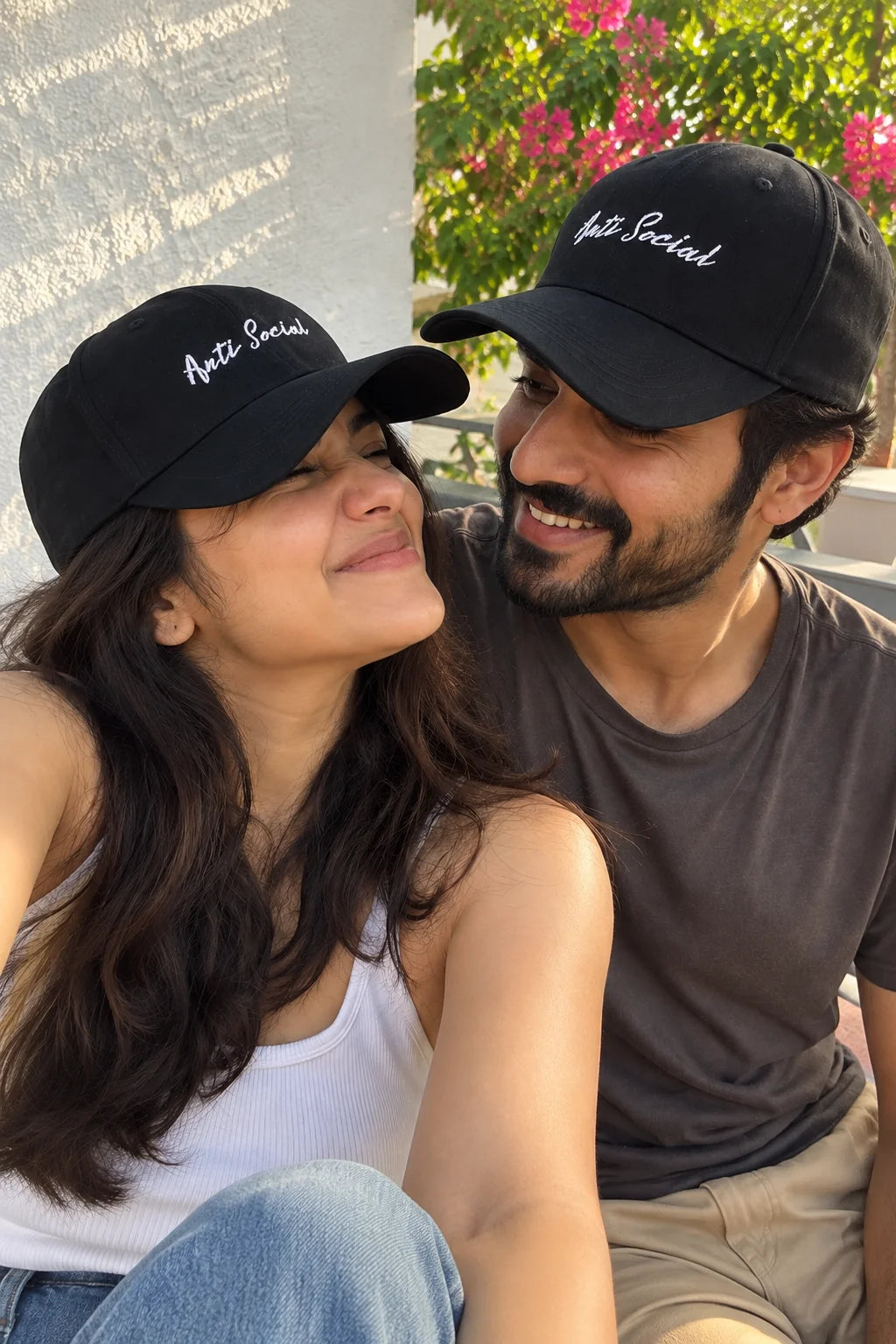Anti Social Unisex Baseball Cap by The Edi Archive, The Side Quest Collection, couple wearing matching black baseball caps