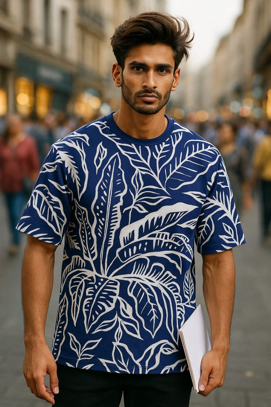 Man wearing a  oversized t-shirt, Blue Life from The Edi Archive,  on a city street.