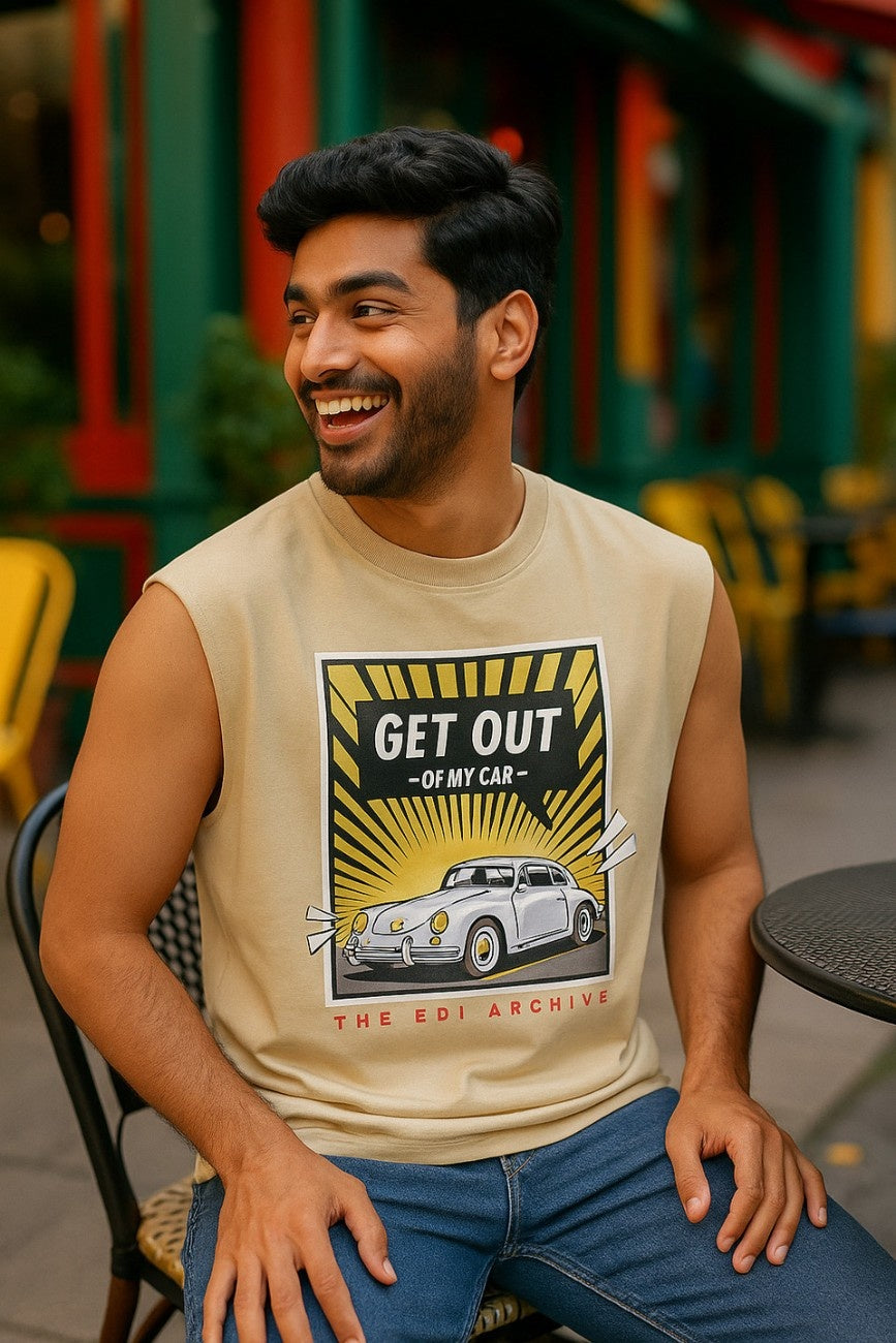 Get Out Of My Car Unisex Oversized Graphic Tank Top Off White paired with blue jeans model seated at outdoor cafe The Edi Archive CTRL+Me Collection