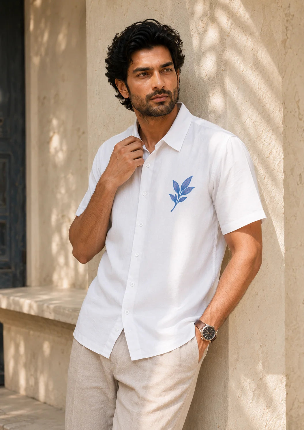 Front and back view of a minimalist white leaf print shirt for men styled with beige linen trousers and loafers, Ink Leaf Hawaiian Shirt, Tropical Drop, The Edi Archive