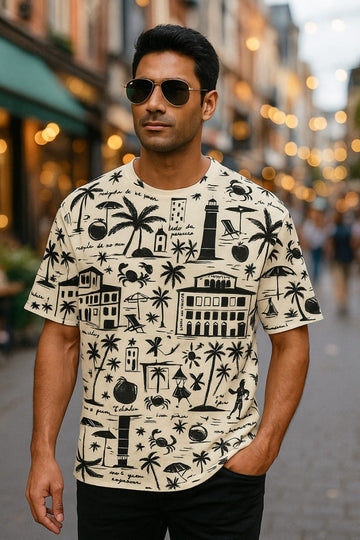 Man wearing a patterned oversized T-Shirt, Live Wild from The Edi Archive, on a street with blurred lights in the background