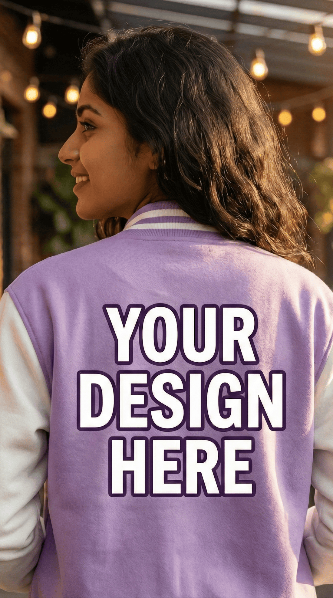 Person wearing a purple varsity jacket with 'Your Design Here' text on the back from the Custom Archive collection of The Edi Archive.