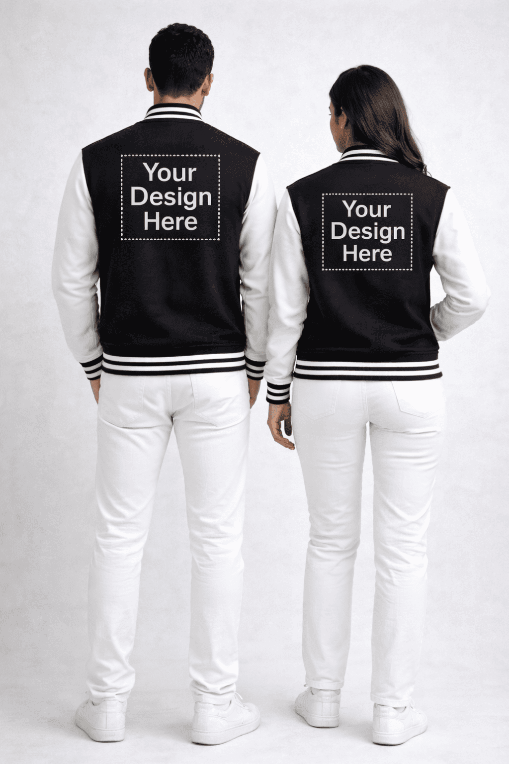 Two people wearing black and white varsity jackets with customizable text - back view - from Custom Archive Collection by The Edi Archive