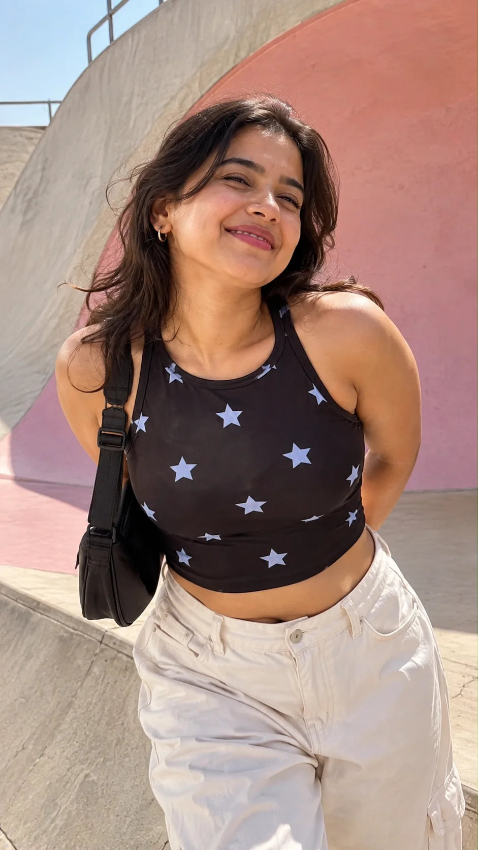 The Edi Archive Periwinkle Star Crop Top styled with white cargo pants, black stretchable women's crop top with periwinkle stars