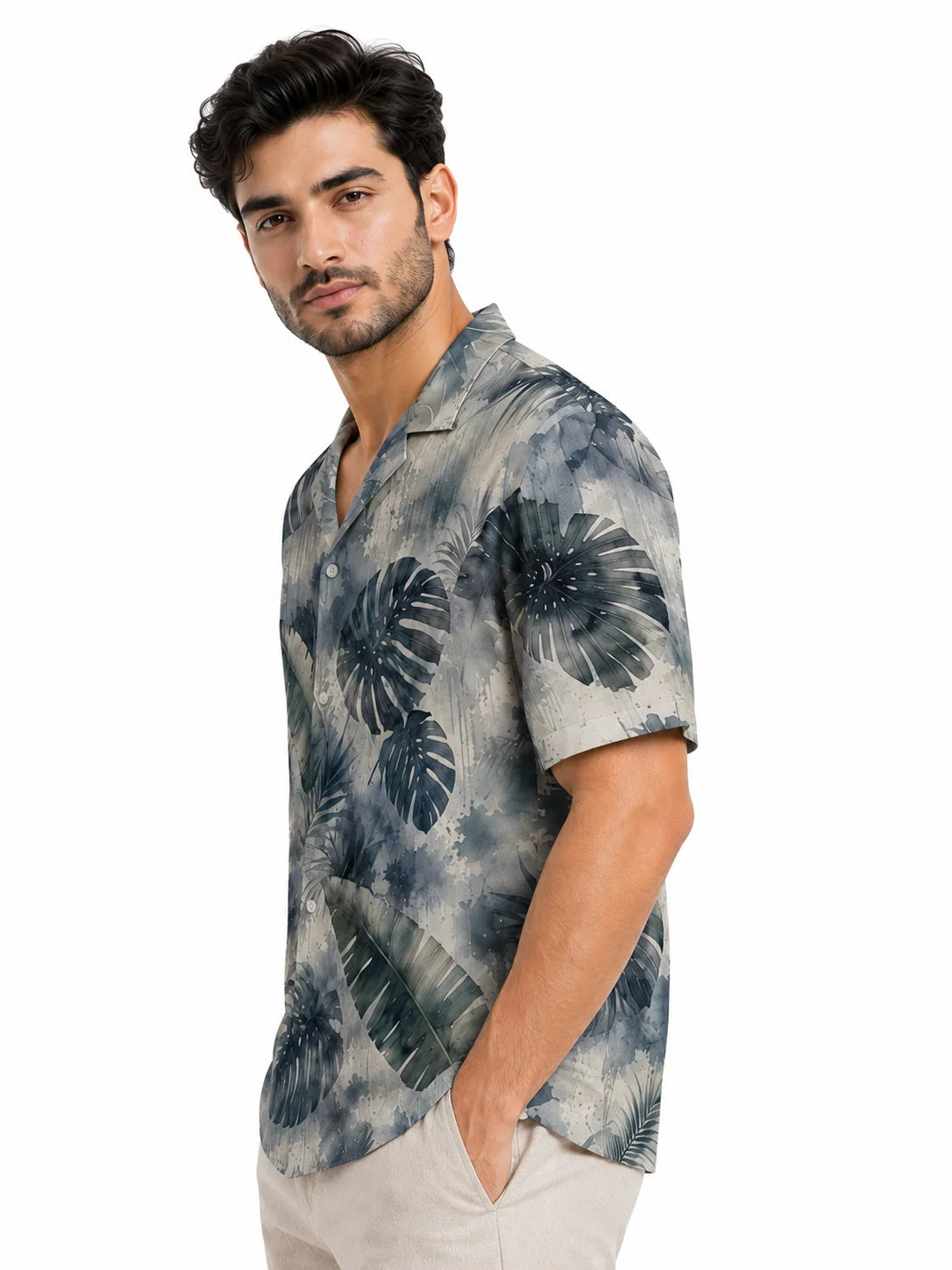 Petrichor linen blend camp collar shirt styled with stone trousers, left side view, muted tropical watercolour print from The Tropical Drop by The Edi Archive