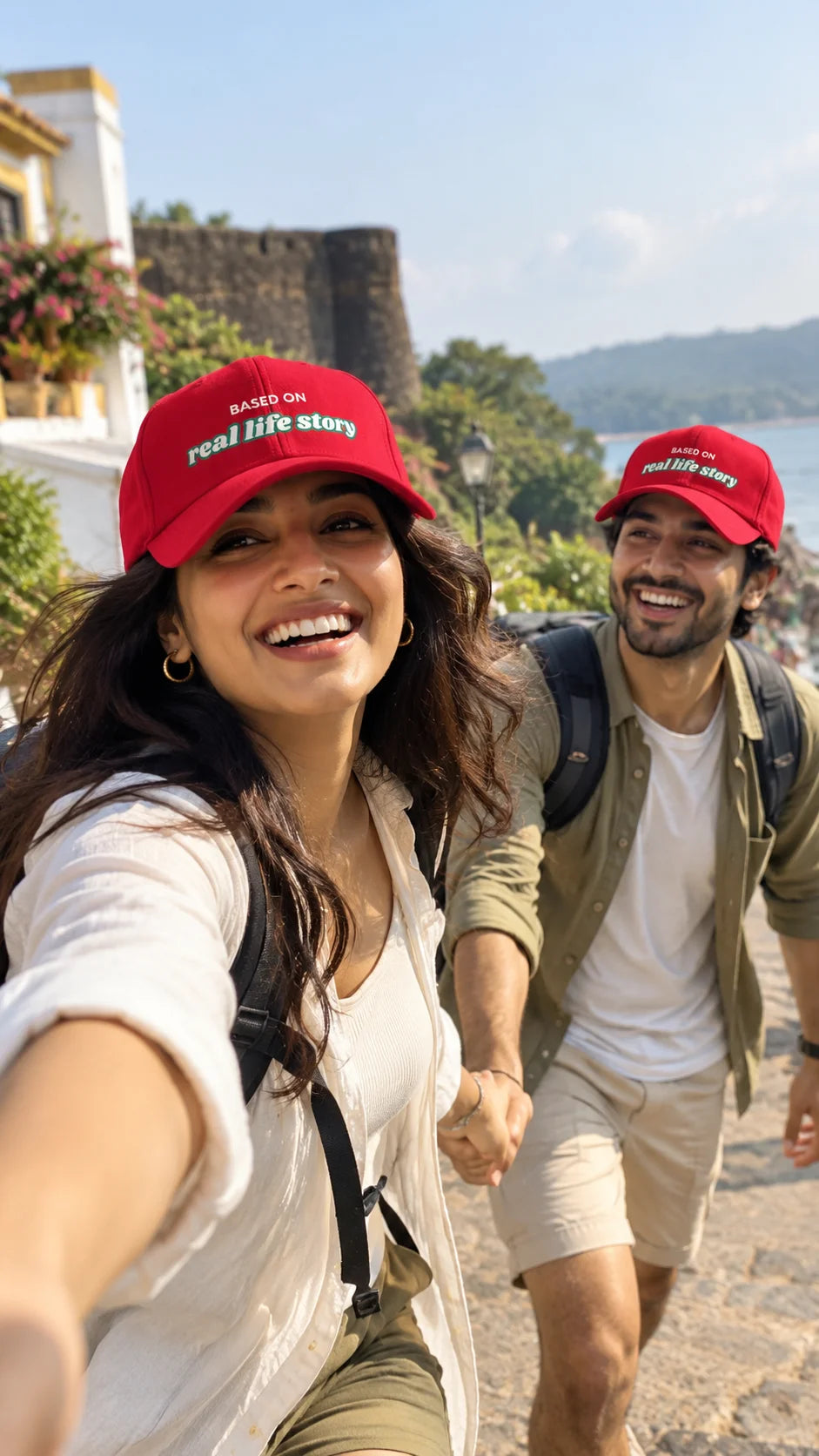 Real Life Story Unisex Snapback Cap by The Edi Archive, The Side Quest Collection, couple wearing matching red caps