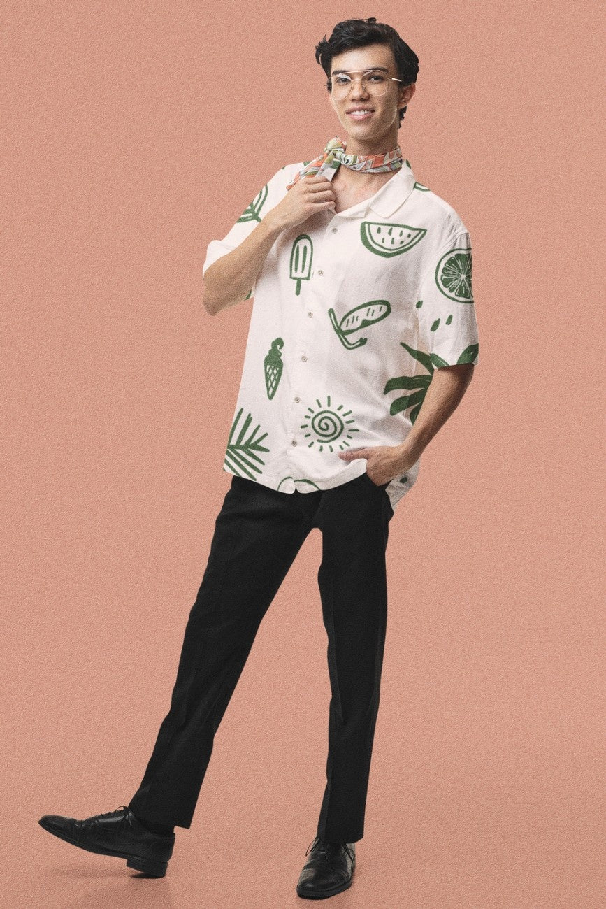 Man wearing a patterned Summer Vacation Hawaiian Shirt from Tropical Drops from The Edi Archive