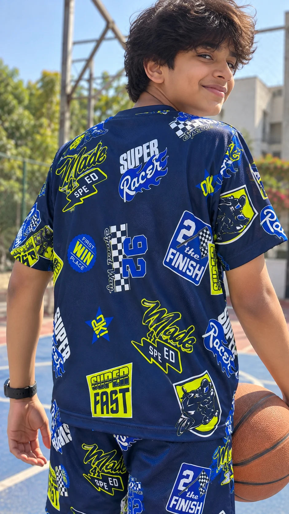 Super Racer Kids AOP Co-ord Set by The Edi Archive showing the back of the racing-inspired printed T-shirt and matching shorts