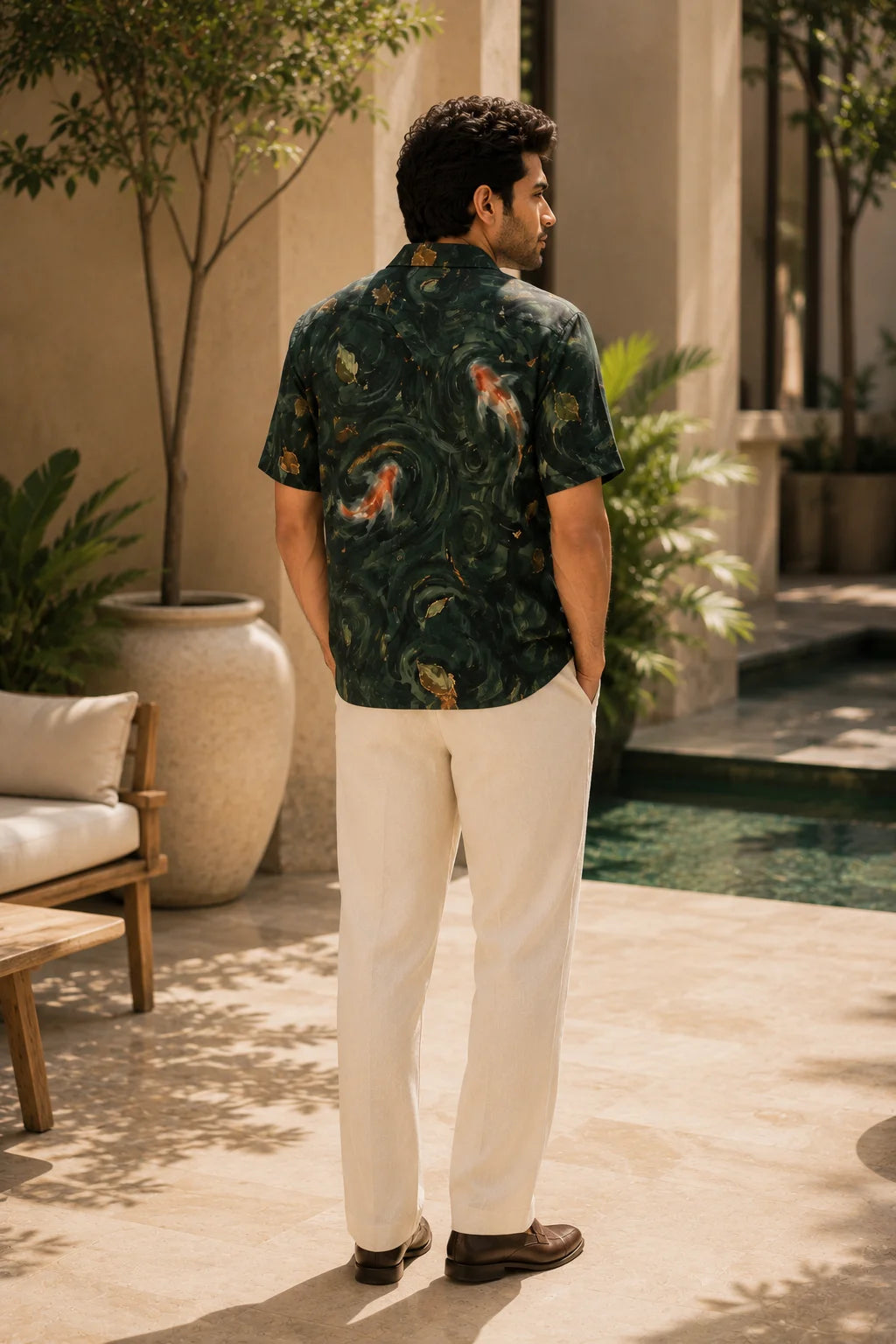 Back view of Under Tow Regular Fit Hawaiian Shirt by The Edi Archive from the Tropical Drop Collection showcasing seamless all-over koi pond artwork on premium linen blend fabric