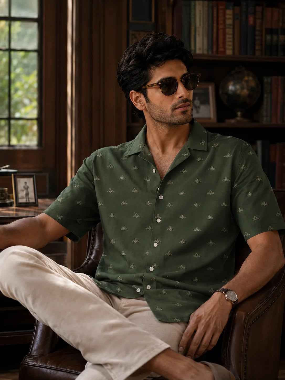 Velvet Moth Regular Fit Hawaiian Shirt by The Edi Archive from The Soft Launch Collection, men's forest green linen blend resort shirt with minimal moth print styled with cream linen trousers