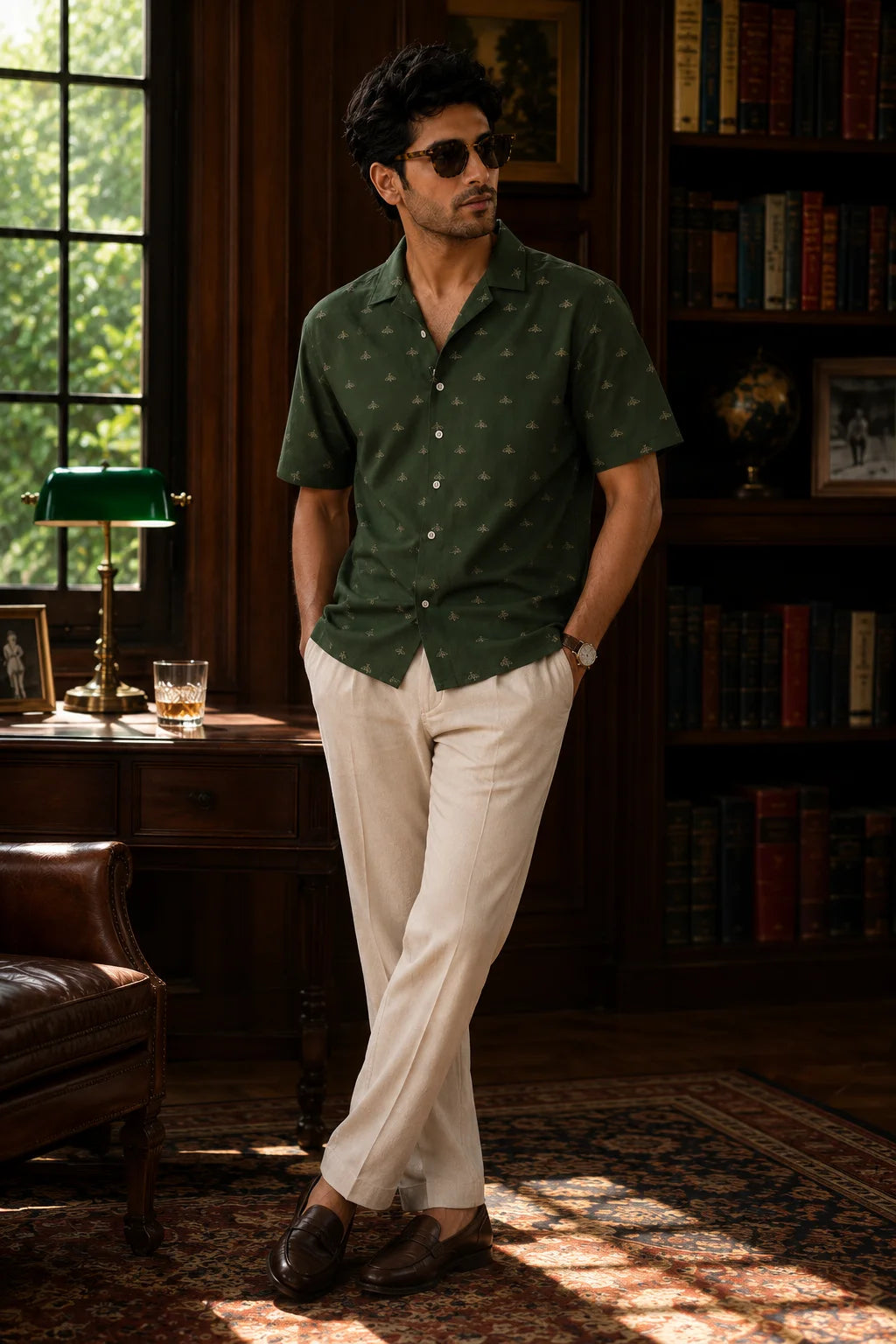 Men's Velvet Moth Regular Fit Hawaiian Shirt by The Edi Archive from The Soft Launch Collection, forest green Cuban collar resort shirt paired with cream trousers for smart casual summer style