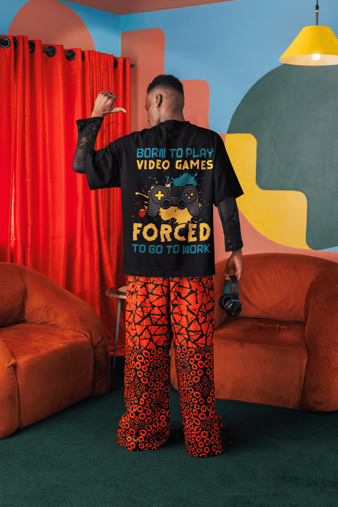 Two people wearing "Born to Play Games" Oversized Unisex t-shirts from The Edi Archive huge graphics back print