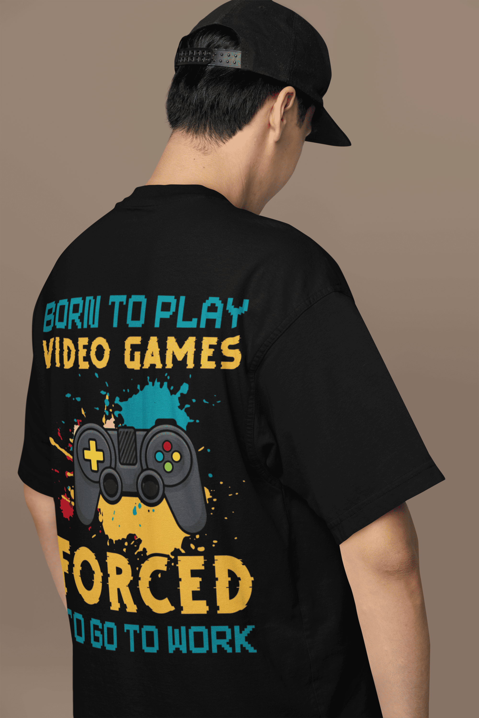 A man wearing "Born to Play Games" Oversized Unisex t-shirts from The Edi Archive huge graphics back print