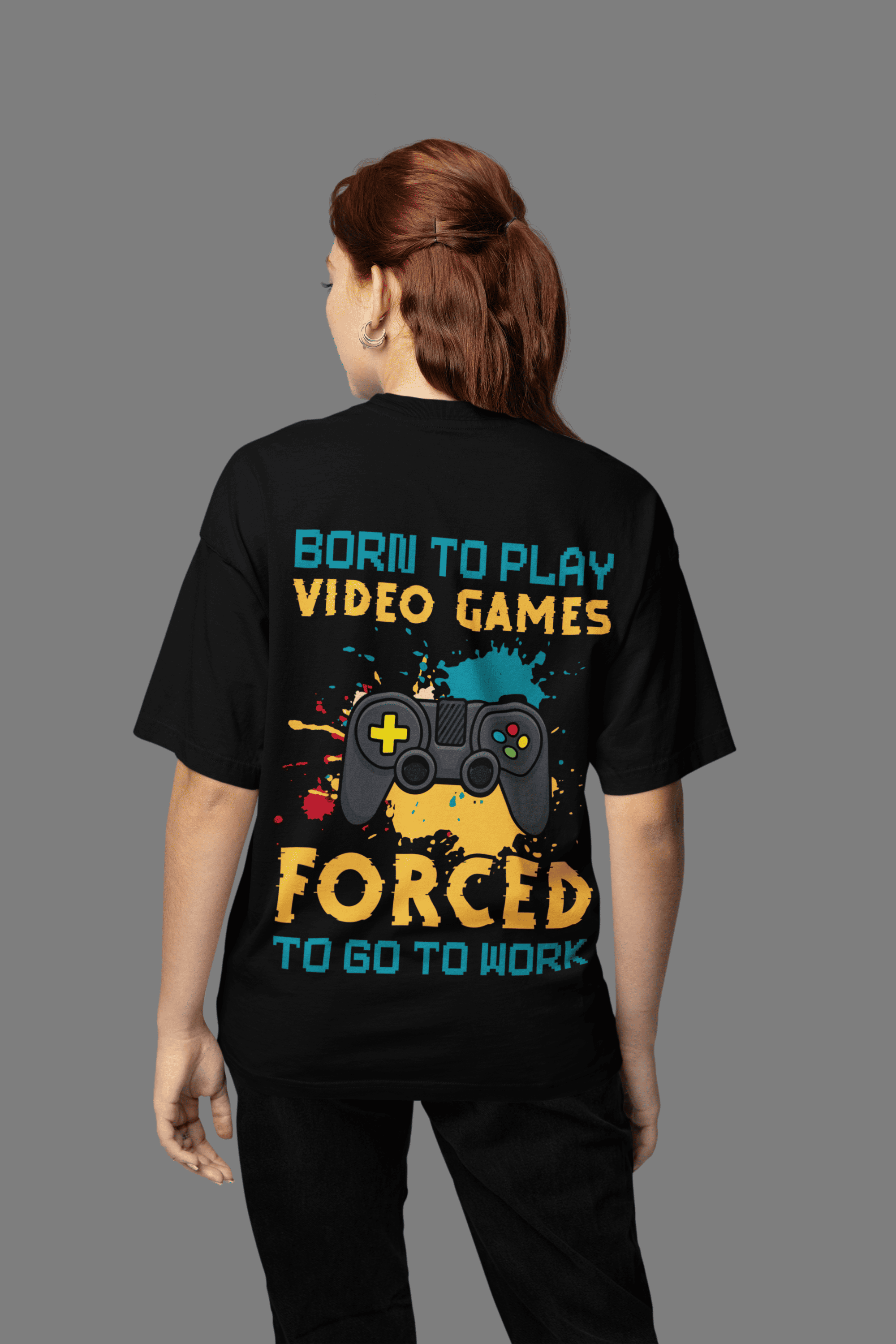 A woman wearing "Born to Play Games" Oversized Unisex t-shirts from The Edi Archive huge graphics back print