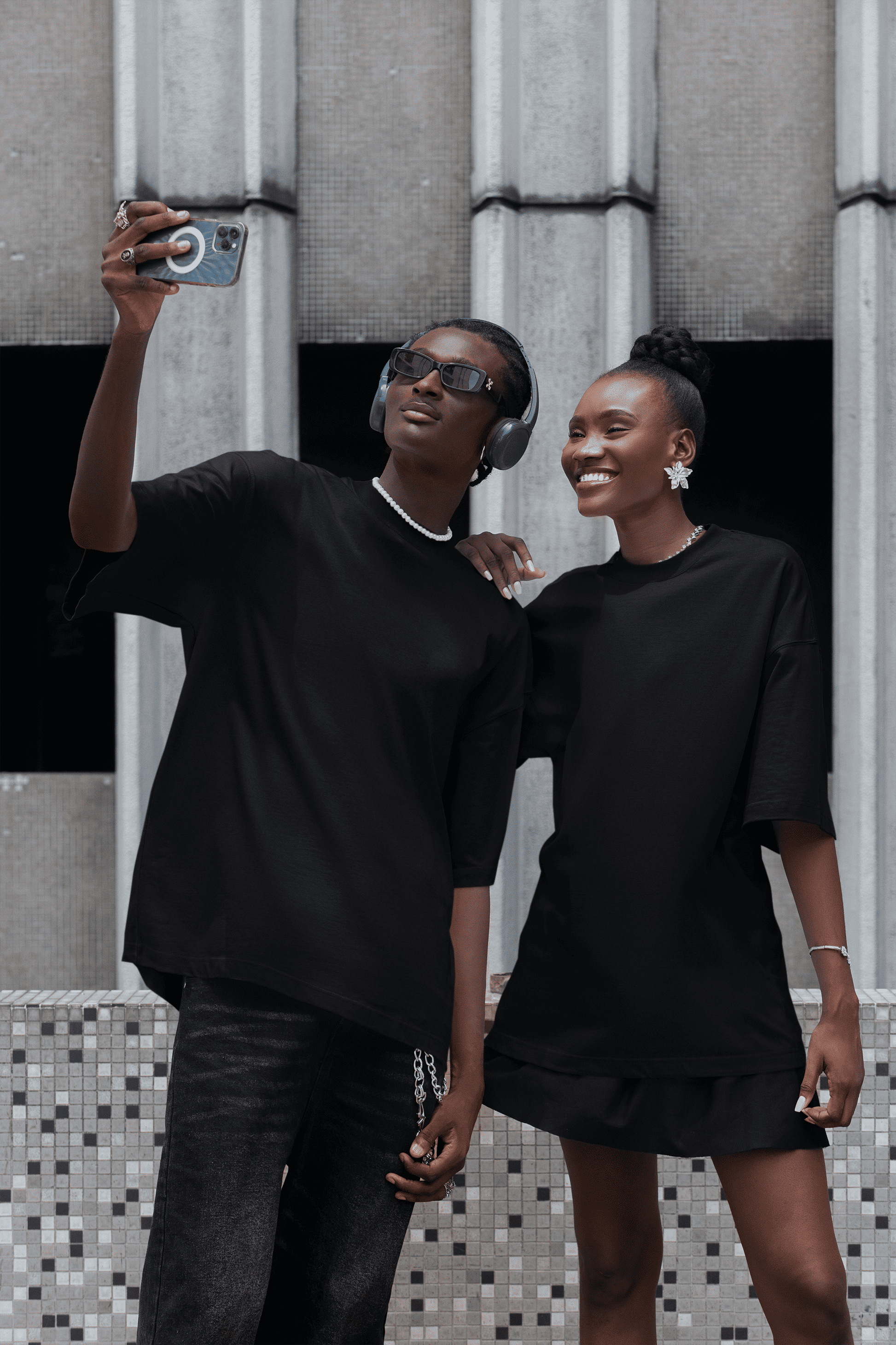 Two people wearing "Born to Play Games" Oversized Unisex t-shirts from The Edi Archive huge graphics back print