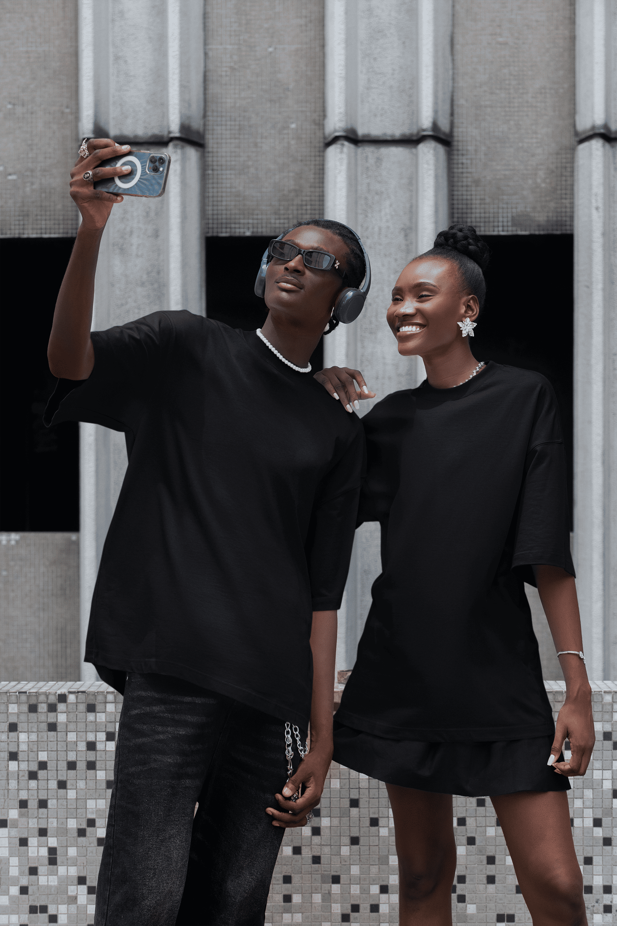 Two people wearing "Born to Play Games" Oversized Unisex t-shirts from The Edi Archive huge graphics back print