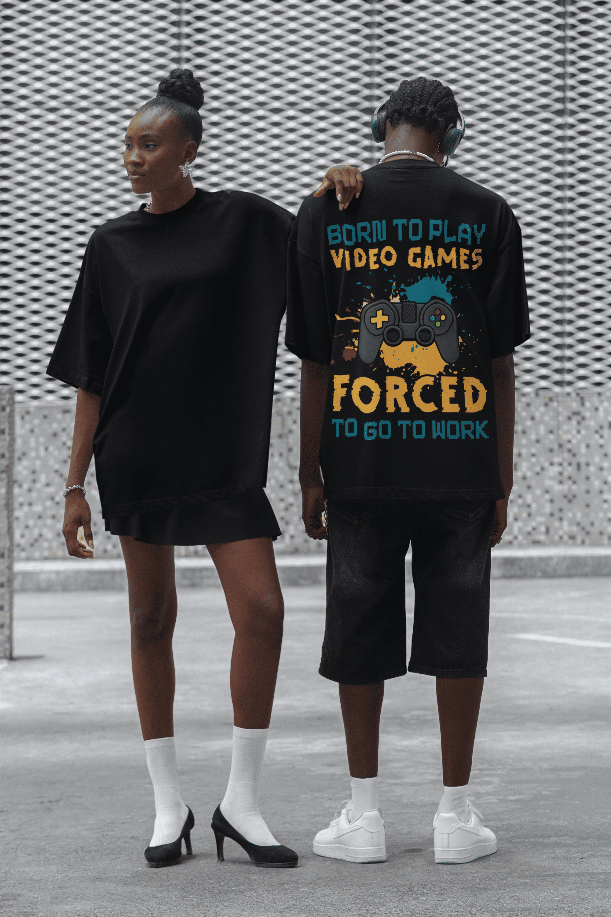 Two people wearing "Born to Play Games" Oversized Unisex t-shirts from The Edi Archive huge graphics back print